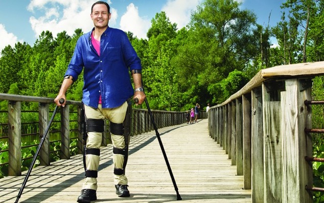 Tony uses the exoskeleton to take a walk with his family.